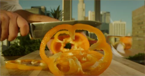 Slicing yellow paprika view from inside, sliding over cooking table Stock Footage 126301981