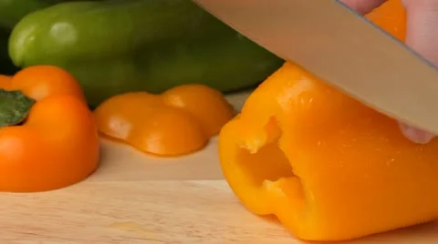 Slicing a yellow pepper Video stock 22262934