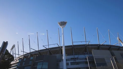 Slide and Tilt down wide shot of the MCG on sunny day Stock Footage 106600019