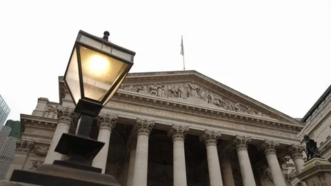 Slide behind old lamp from facade of Royal Exchange Stock Footage 127894606