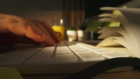 Slide camera over a keyboard on which the source code writer developer Stock Footage 172554864