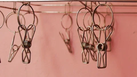 Slide on Clothespin on pink background. Stock Footage 129377091