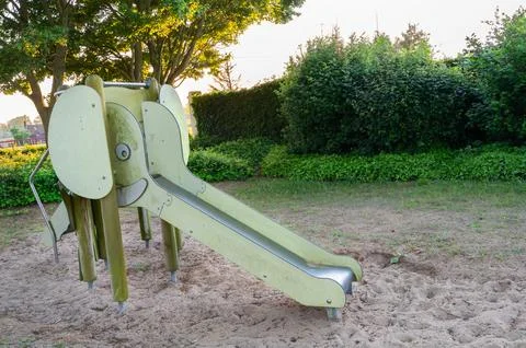 A slide designed in the whimsical shape of an elephant at a playground 写真素材
