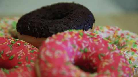 A slide of donuts lie on the table Video stock 90304512