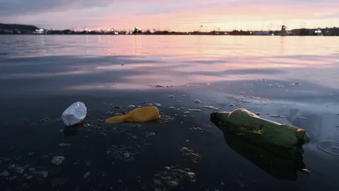 Slide drone lot of plastic bottles, garbage on the sandy beach of the Black Sea Stock Footage 108723315