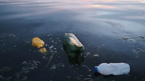 Slide drone lot of plastic bottles, garbage on the sandy beach of the Black Sea Stock Footage 108723317