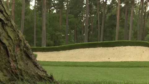 Slide forward towards golf bunker Stock Footage 80468324