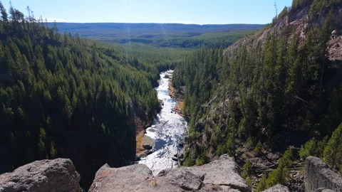 Slide of Gibbon River below waterfall in Yellowstone - dolly Stock Footage 320033109