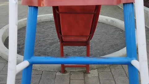 A slide that has a sand circle underneath Stock Footage 218243861