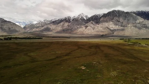 Slide left to right  snow-capped Sierra mountains in backgroundin California Video stock 109036219