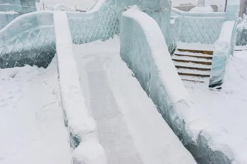 Slide made of ice .   objects made of snow and ice. .winter fun for children Stock Photos