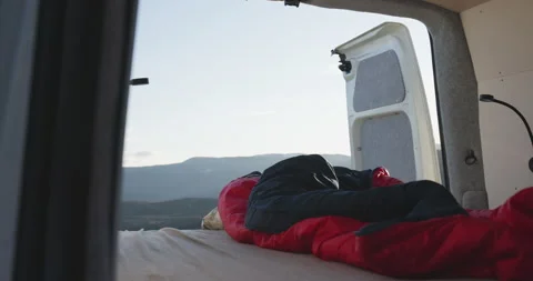 Slide motion reveal campervan bed with open back doors in Jotunheimen Stock Footage 252641965