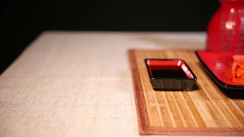 Slide Motion of Sushi on Bamboo Background Video stock 69945423