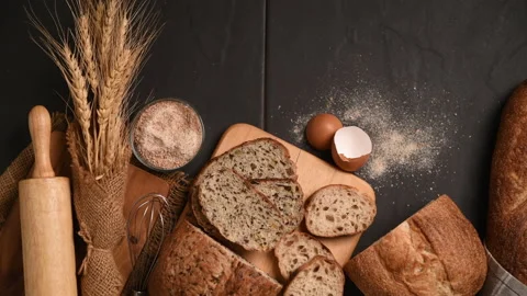 Slide multi grain sourdough bread and sliced Baguette Stock Footage 233817799
