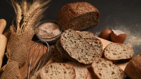 Slide multi grain sourdough bread and sliced Baguette with Whole Wheat Flour Stock Footage 233820328