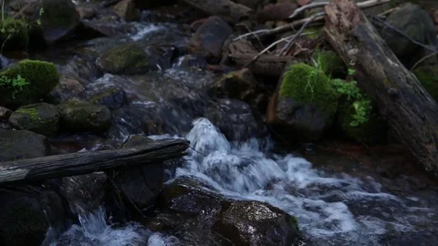 Slide over rocky stream Stock Footage 93996238