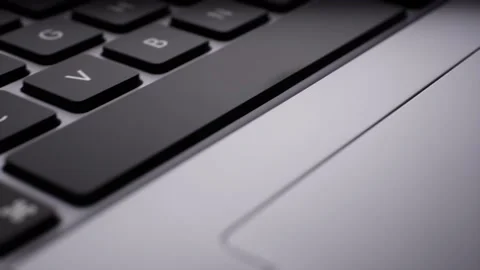 A Slide right over laptop keyboard and mouse trackpad Stock Footage 155222668