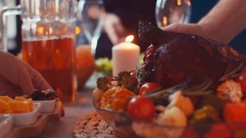 Slide shooting along festive table on which hands put dishes. Christmas family Stock Footage 144665794