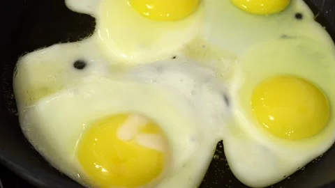 Slide-shooting of the process of cooking scrambled eggs. Macro dolly preparin Video stock 218581587