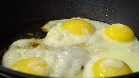 Slide-shooting of the process of cooking scrambled eggs. Macro dolly preparin Stock Footage 244335581