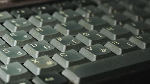 Slide shot across laptop computer QWERTZ keyboard Portable retro tech Video stock 312020417