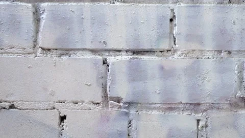 Slide shot of brick wall surface. Slow vertical Macro of a brick surface with Stock Footage 218581781