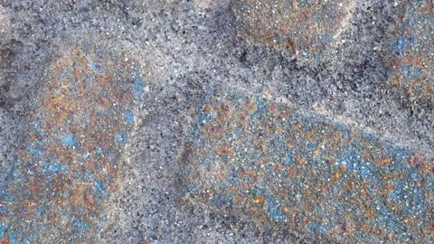 Slide shot of the cast iron surface of a metal manhole. Slow macro dolly iron Stock Footage 203825003