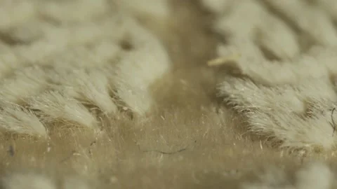 Slide shot, macro close-up of soft white carpet and thread. Stock Footage 150112163