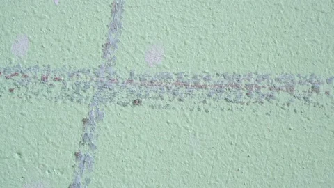 Slide shot of a painted wall surface. Slow Vertical Macro Dolly. Light green  Stock Footage 204853034