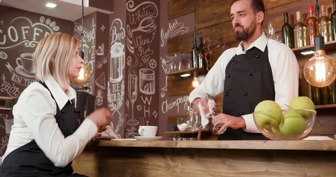 Slide shot of restaurant workers chatting after work Stock Footage 104866376