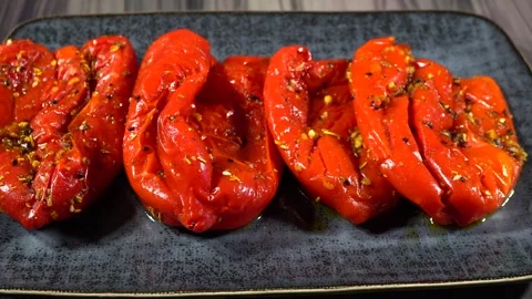Slide shot of roasted red bell peppers. Close-up of a dolly of baked peppers  Stock-Footage 244335983
