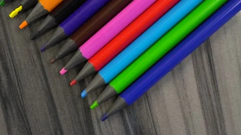 Slide shot of a set of colored sharpened pencils. Slow macro dollar on a gray 스톡 동영상 203822537