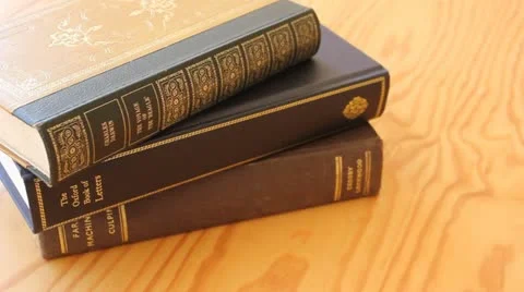 Slide shot of stack of books on table Video stock 11867631