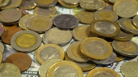 Slide shot of various coins from different countries on the table. Slow macro Video stock 203820669