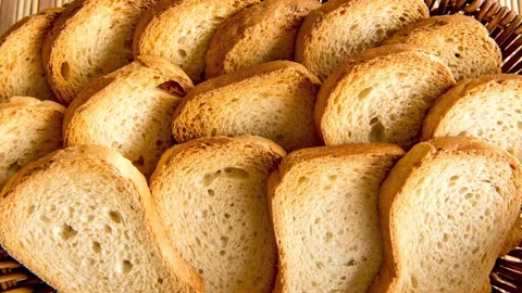 Slide show Basket with toasted bread on breakfast table Stock Footage 167970308