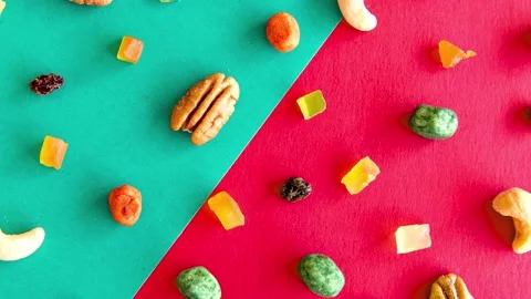 Slide show of Walnuts, peanuts and cashews on a Christmas table top view Stock Footage 165423944