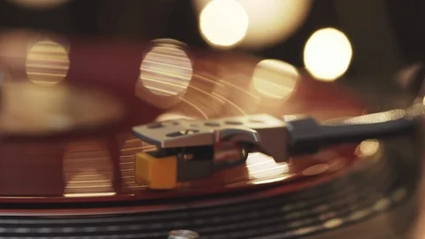 A slide turntable vinyl record player, plate on a light with bright lights Stock Footage 94449283