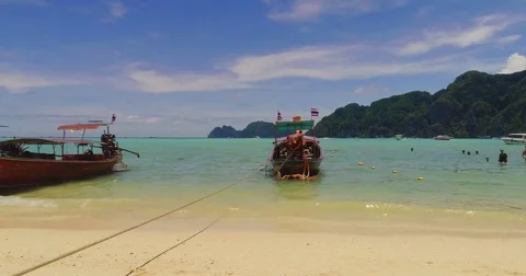 Slide video of the beach with boats at Phi-Phi island. Drone video of Stock Footage 75726475