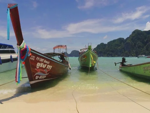 Slide video of the beach with boats at Phi-Phi island. Drone video Stock Footage 75726616