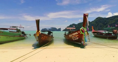Slide video of the beach with boats at Phi-Phi island. Drone video of Video stock 75733966