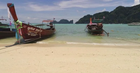 Slide video of the beach with boats at Phi-Phi island. Drone video of Stock Footage 75734071