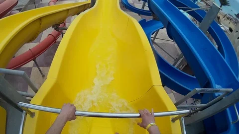Slide on a yellow pipe at Aqua Park Egypt Hurgada Stock Footage 74658445