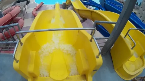 Slide on a yellow pipe at Aqua Park Egypt Hurgada Stock Footage 74658762