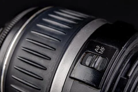 Slider for changing the autofocus mode. Buttons to change the lens mode. Stock Photos