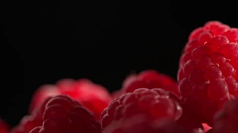 Slider glides past raspberry on black. Healthy food. 動画素材 314179301