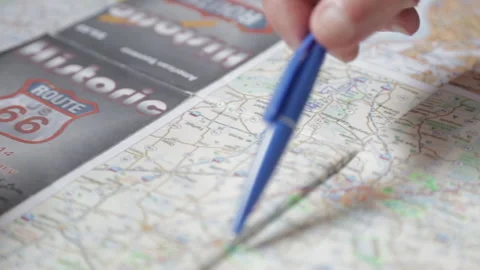 Slider macro shot hands over travel map Stock Footage 142736643