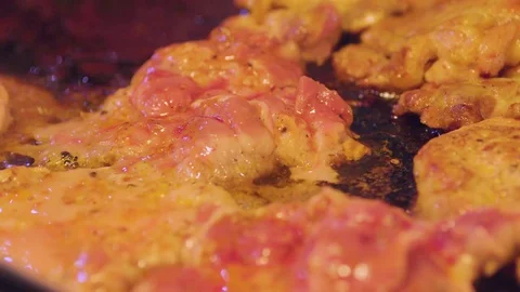 Slider macro shot of three slices of frying cooked bacon Stock Footage 72227464