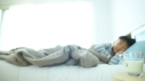 Slider motion Boy drink milk before sleep 库存影片 61373364