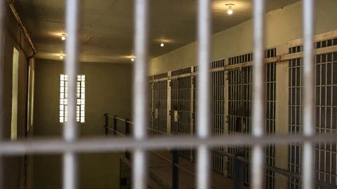 Slider Move Looking Through Bars on Jail Cell - Shallow Depth of Field Stock Footage 246119097