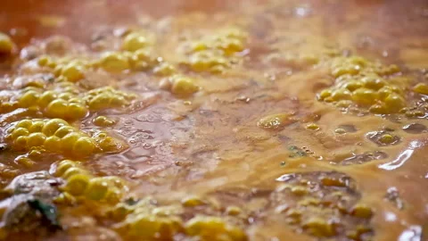 Slider moving camera showing boiling delicious paella in pan Stock Footage 134285552